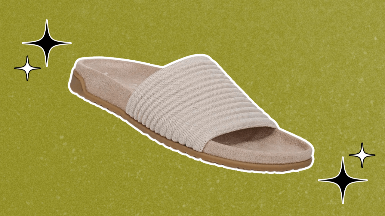 Vionic slide sandals on a green background