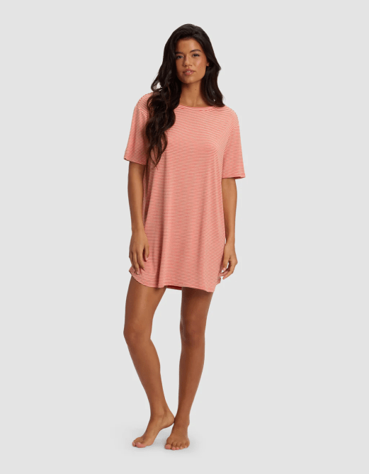 A model wearing the Cozy Earth Bamboo Stretch-Knit Sleep Dress in an orange stripe pattern